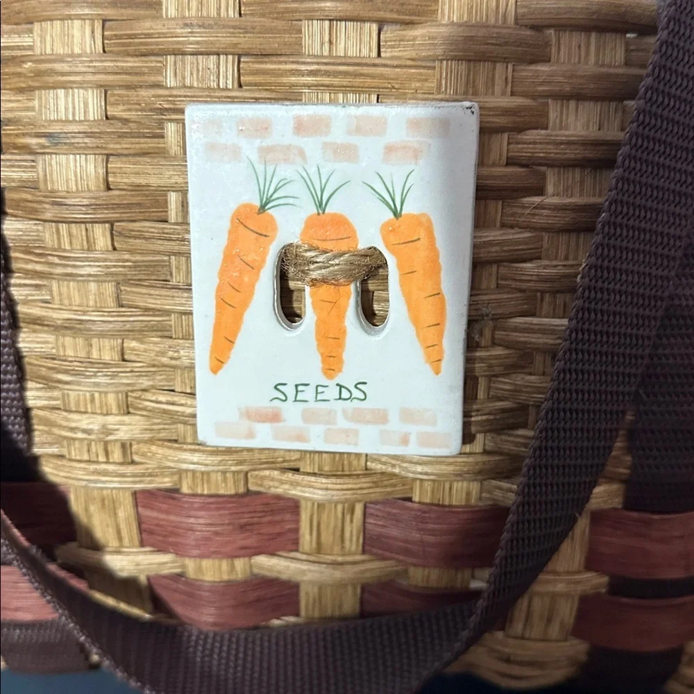 Woven vegetable basket with handles — carrot plaque decor